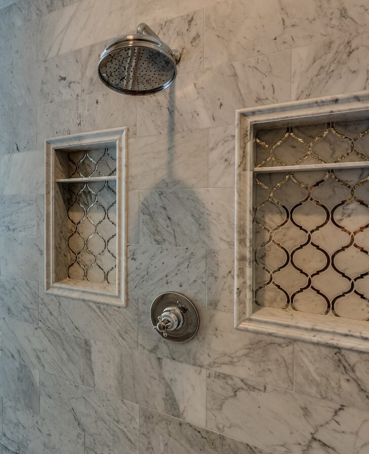 Spacious Rock Hill shower featuring porcelain tile with a luxurious stone look.